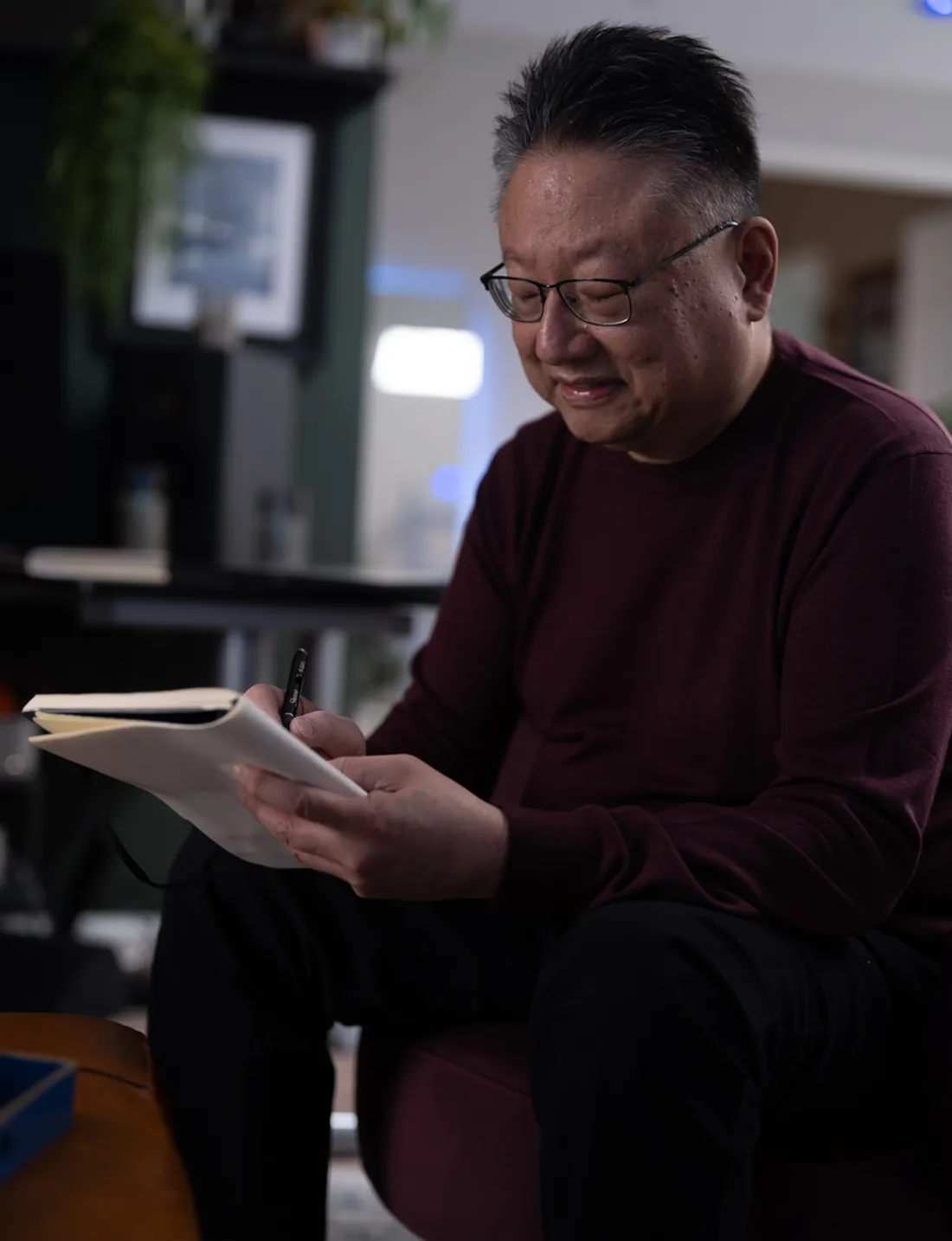 Steve Nye writing in a notebook during a session